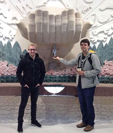 Two students posing in the hall of Beijing museum